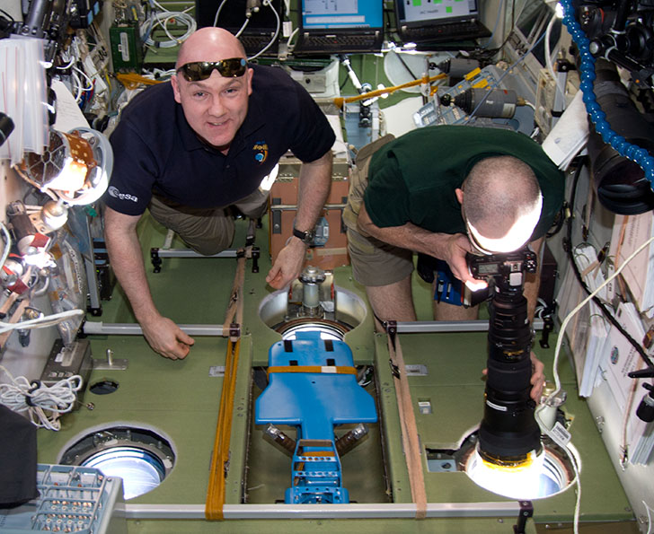 astronauts taking images of Earth from ISS